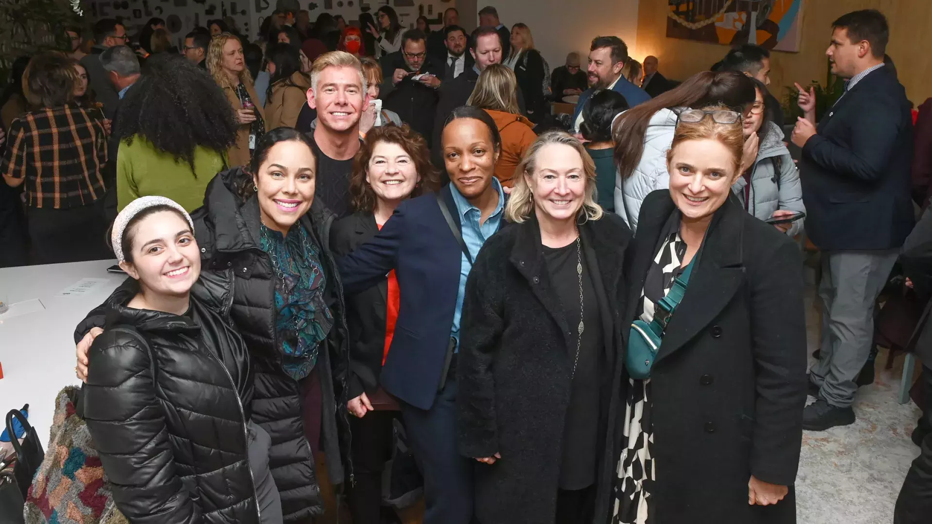 Staff and members gather at an official San Francisco Travel event.