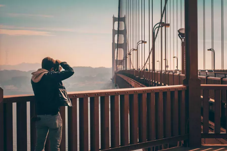 Man taking photos on the Golden Gate Bridge