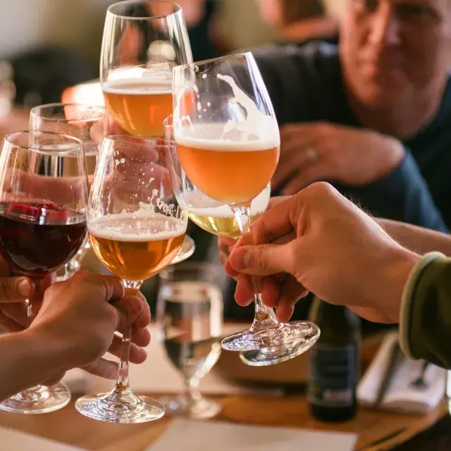 A group of travelers share a drink at a San Francisco bar.