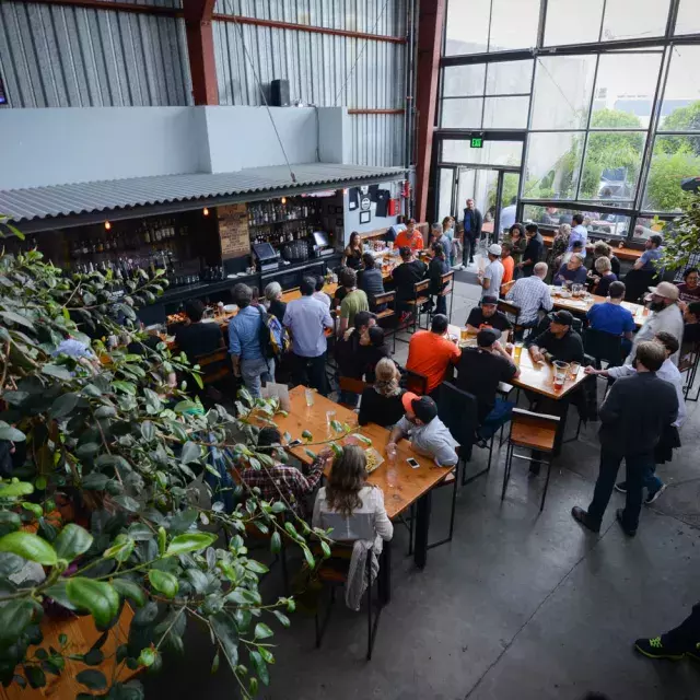 Patrons eat and drink at Southern Pacific Brewing in San Francisco.