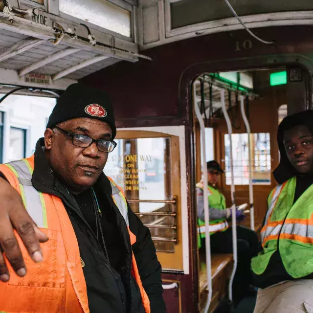 Ellis Cato and his son on a cable car.